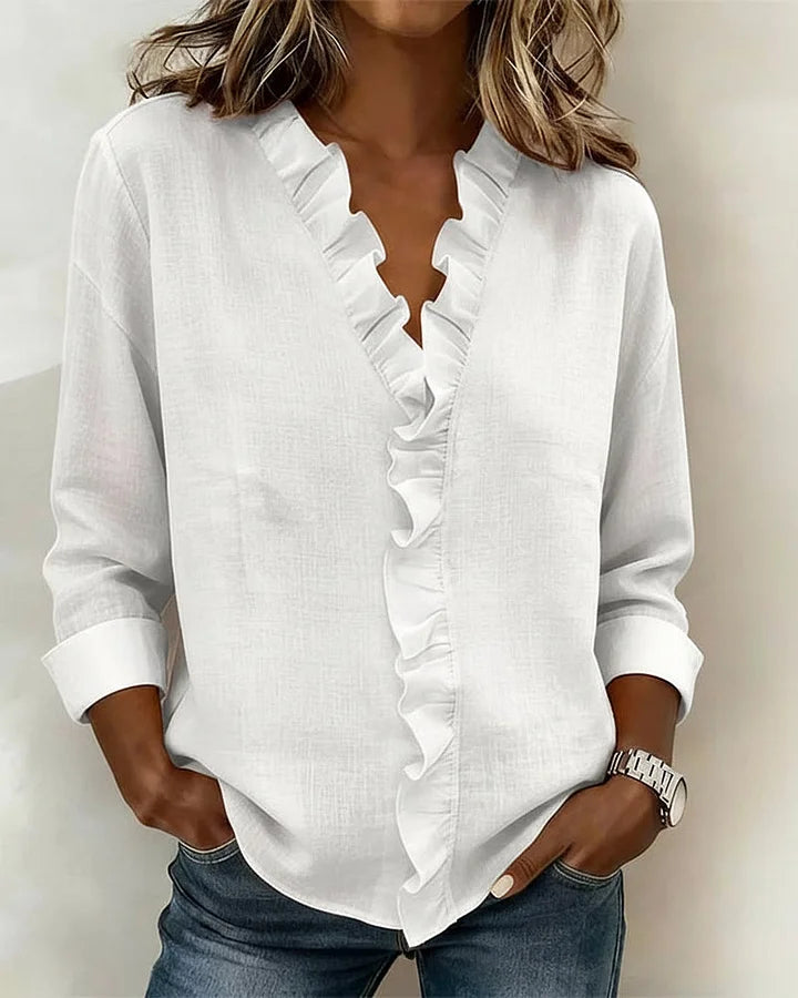 Indie | Bluse mit Rüschen, V-Ausschnitt und langen Ärmeln" 

Rewritten: "Indie | Ruffled Blouse with V-Neck and Long Sleeves