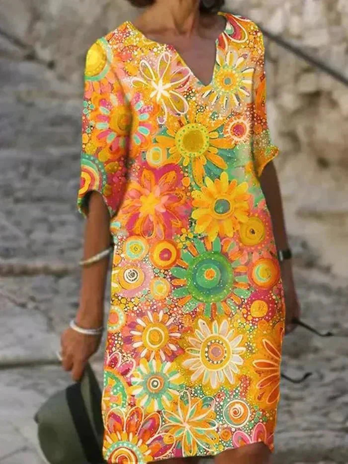 "Nira | Lebhaftes Blumen-Midi-Kleid" can be rewritten as "Nira | Buntes Blumen-Midi-Kleid".
