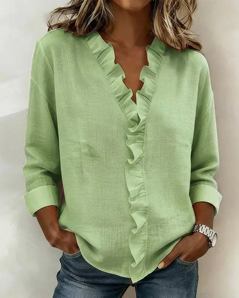 Indie | Bluse mit Rüschen, V-Ausschnitt und langen Ärmeln" 

Rewritten: "Indie | Ruffled Blouse with V-Neck and Long Sleeves