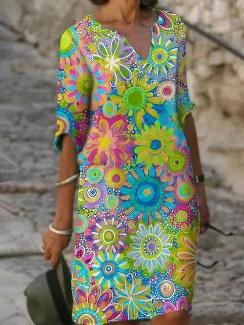 "Nira | Lebhaftes Blumen-Midi-Kleid" can be rewritten as "Nira | Buntes Blumen-Midi-Kleid".