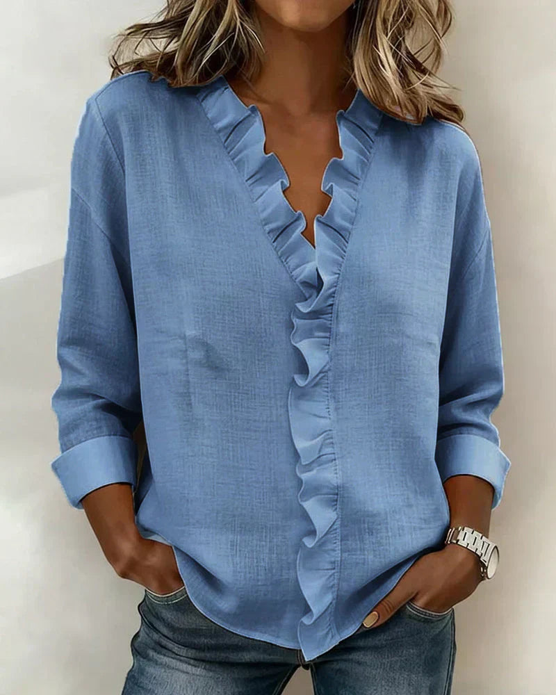 Indie | Bluse mit Rüschen, V-Ausschnitt und langen Ärmeln" 

Rewritten: "Indie | Ruffled Blouse with V-Neck and Long Sleeves