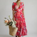 MINELDA | ELEGANTES BLUMENKLEID" can be rewritten as "MINELDA | STYLISH FLORAL DRESS.